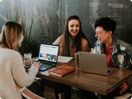 Colleagues sitting at table in co-working space