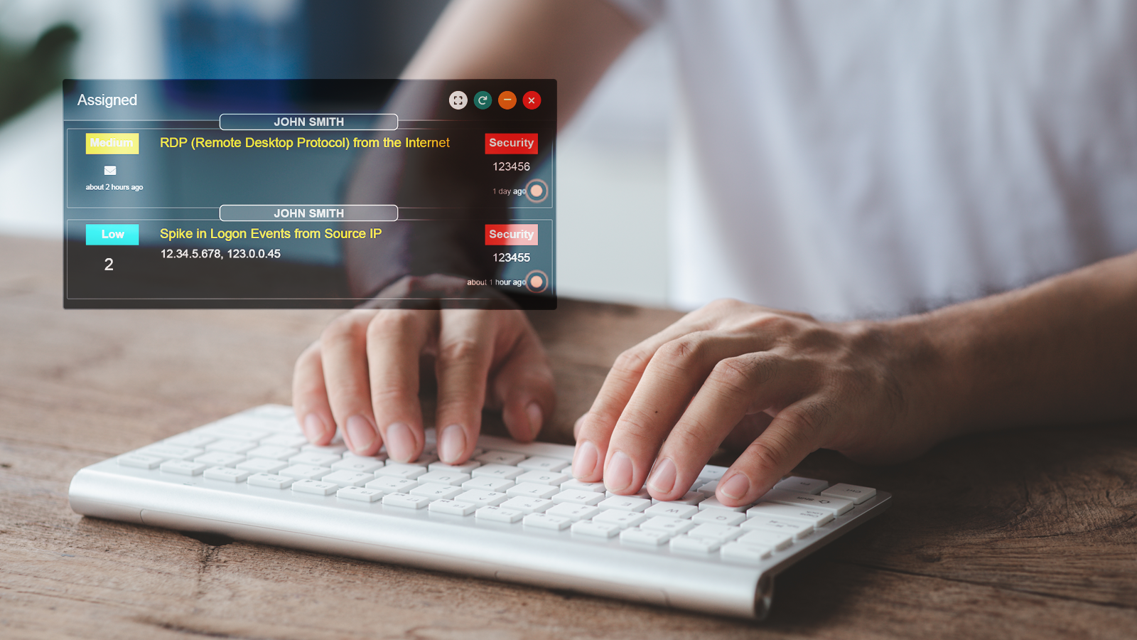 Graphic with man typing on a keyboard with snippets of data overlaying the image. This is showing security events happening by user