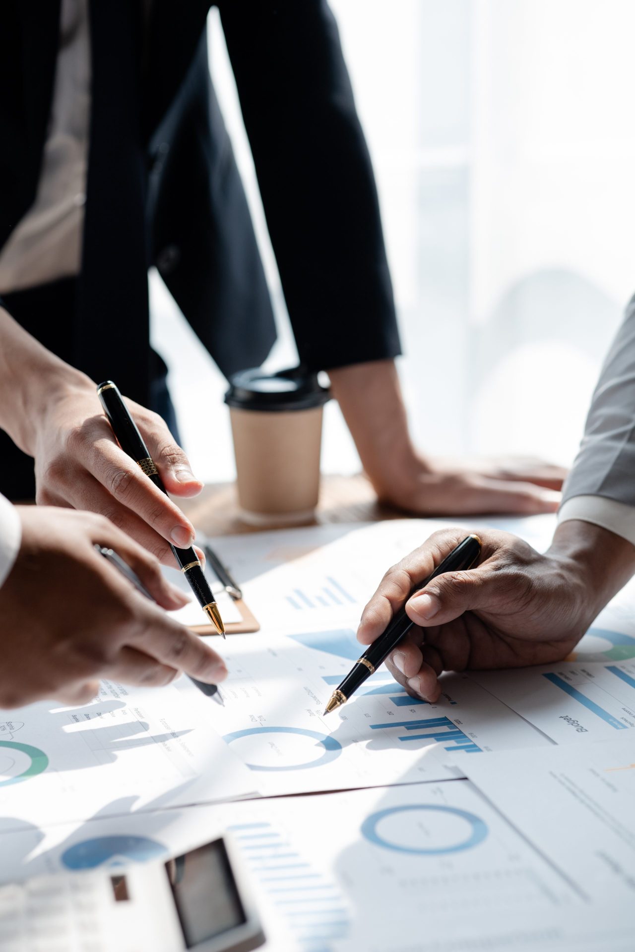 The sales department is having a monthly summary meeting to bring it to the department manager, they are verifying the correctness of the documents that are prepared before bringing in to the manager.